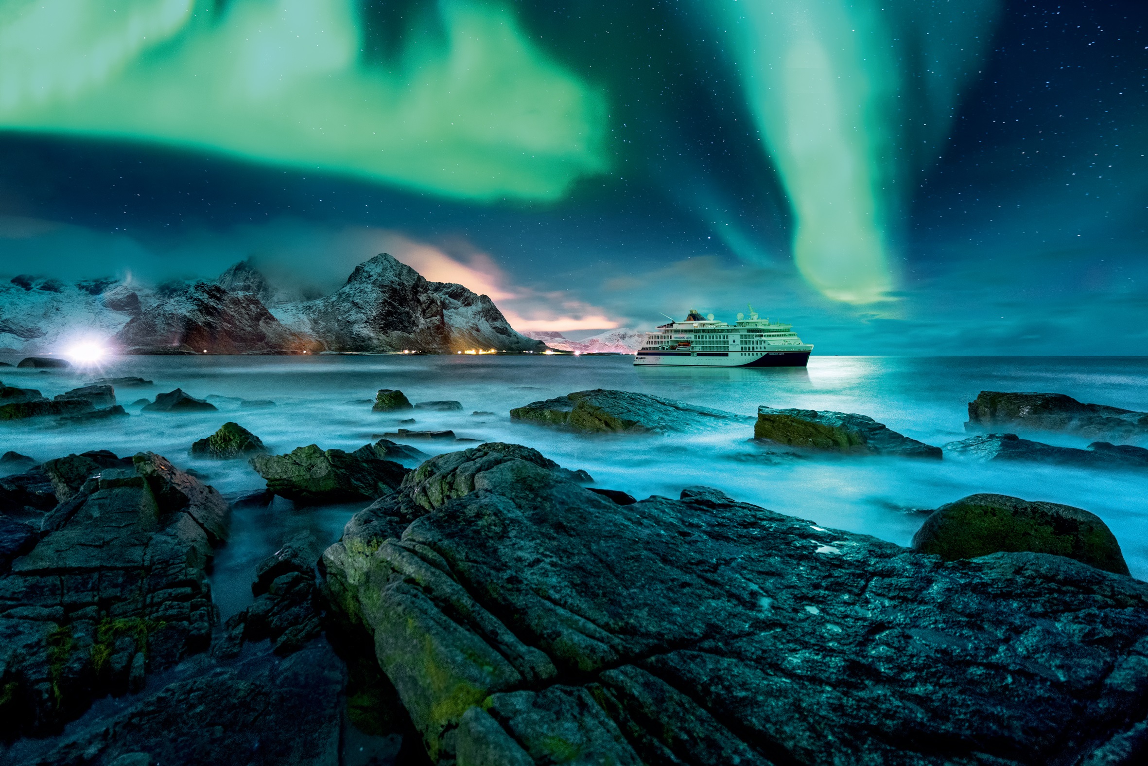 Aurora borealis above snowy islands of Lofoten; Shutterstock ID
